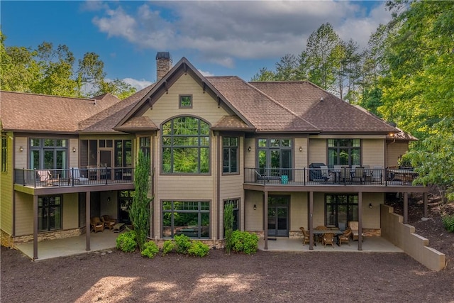 104 Sweetshrub Way, Sunset, SC 29685 - back of house featuring a patio area, a chimney, a shingled roof, and a wooden deck