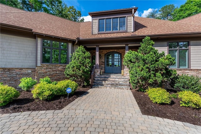 104 Sweetshrub Way, Sunset, SC 29685 - view of exterior entry with roof with shingles, a porch, french doors, and stone siding