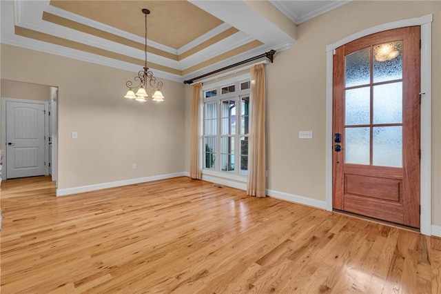114 Royal Troon, Campobello, SC 29322 - entryway featuring a raised ceiling, light wood-style flooring, crown molding, and a chandelier