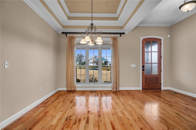 114 Royal Troon, Campobello, SC 29322 - entryway with a raised ceiling, a notable chandelier, crown molding, light wood finished floors, and baseboards