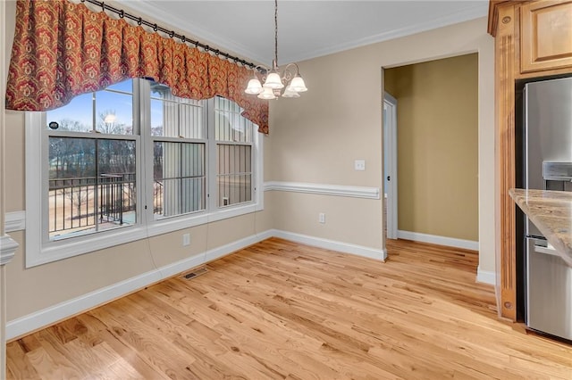 114 Royal Troon, Campobello, SC 29322 - unfurnished dining area with visible vents, a notable chandelier, light wood-style floors, crown molding, and baseboards
