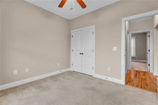 114 Royal Troon, Campobello, SC 29322 - unfurnished bedroom featuring a closet, baseboards, carpet, and a ceiling fan