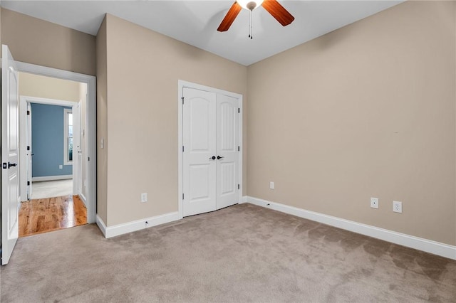 114 Royal Troon, Campobello, SC 29322 - unfurnished bedroom featuring a closet, a ceiling fan, baseboards, and carpet floors