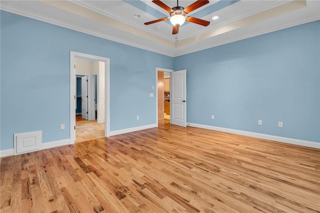 114 Royal Troon, Campobello, SC 29322 - unfurnished bedroom with light wood finished floors, crown molding, baseboards, a tray ceiling, and recessed lighting