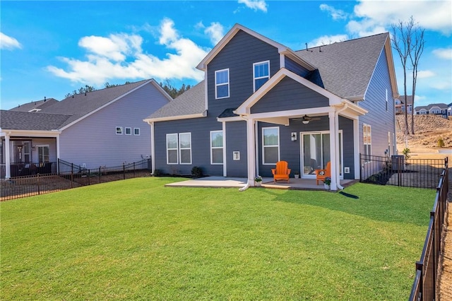 back of house featuring ceiling fan, cooling unit, a lawn, and a fenced backyard