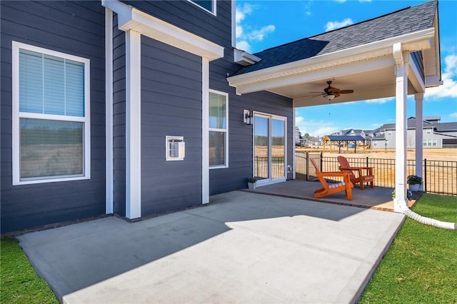 view of patio featuring a ceiling fan and fence