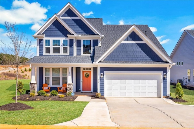 craftsman house featuring a porch, a front yard, roof with shingles, a garage, and driveway