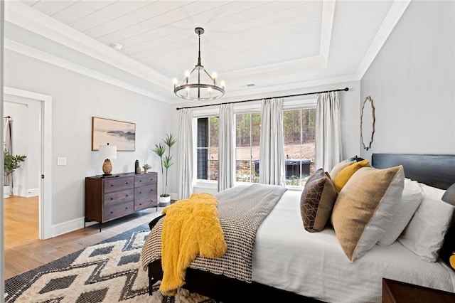 505 Bellhaven Ct, Salem, SC 29676 - bedroom with a notable chandelier, light wood-style flooring, a raised ceiling, and baseboards