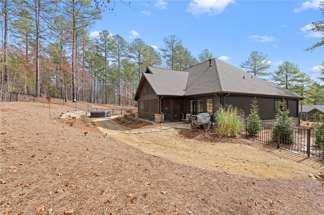 505 Bellhaven Ct, Salem, SC 29676 - view of side of home featuring central air condition unit, fence, a shingled roof, and a sunroom