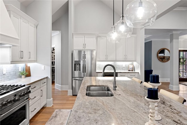 505 Bellhaven Ct, Salem, SC 29676 - kitchen featuring light stone counters, premium range hood, stainless steel appliances, a sink, and white cabinets