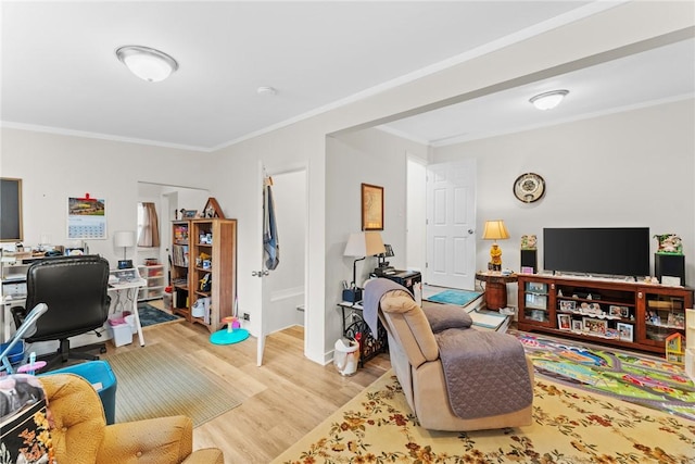 home office featuring crown molding and wood finished floors