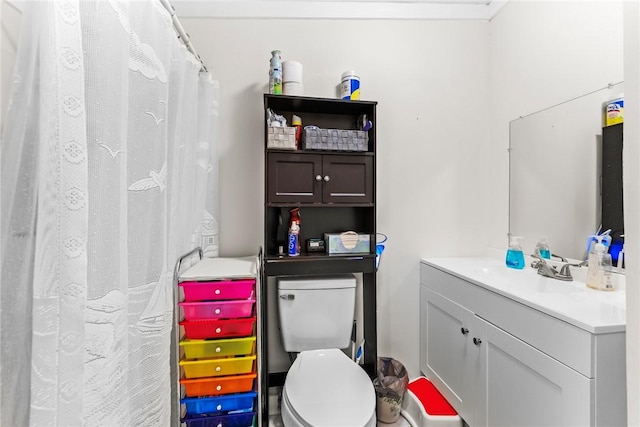 bathroom with toilet and vanity