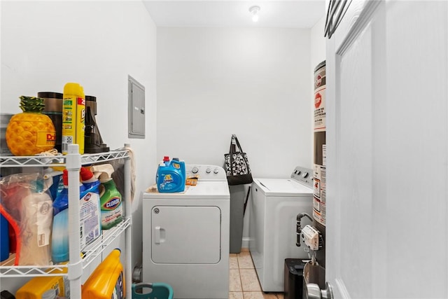 clothes washing area featuring electric panel, laundry area, independent washer and dryer, and light tile patterned floors