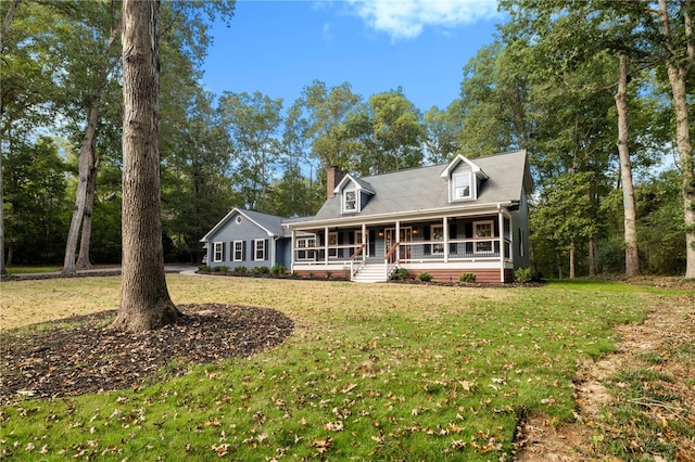 cape cod home featuring a porch and a front yard