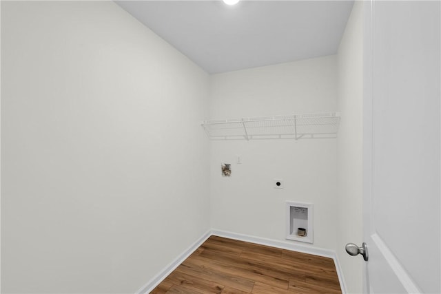 laundry room featuring laundry area, hookup for a washing machine, baseboards, wood finished floors, and hookup for an electric dryer