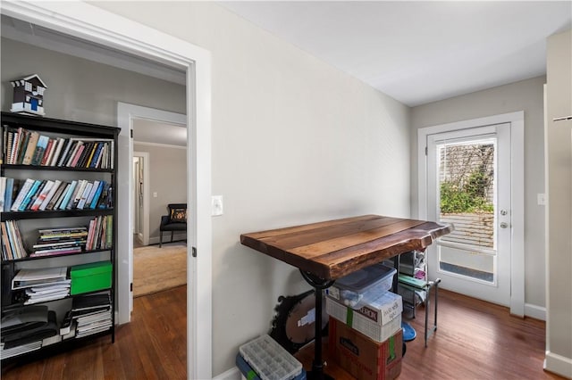 office space with baseboards and wood finished floors