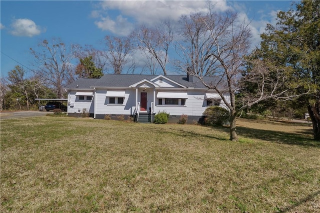 view of front of property with a front yard, a carport, and crawl space