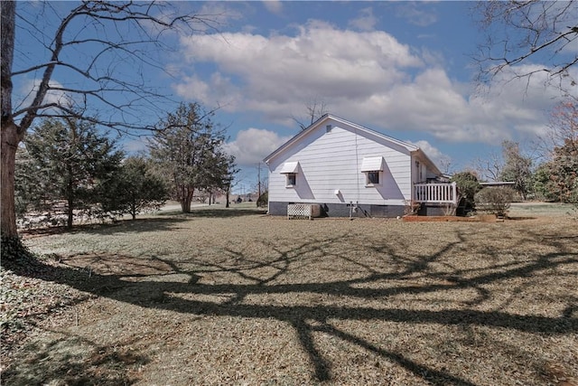 view of side of home with crawl space