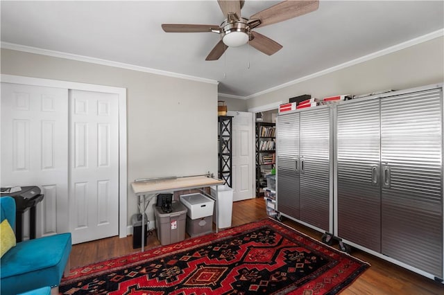 interior space with wood finished floors, ceiling fan, and ornamental molding