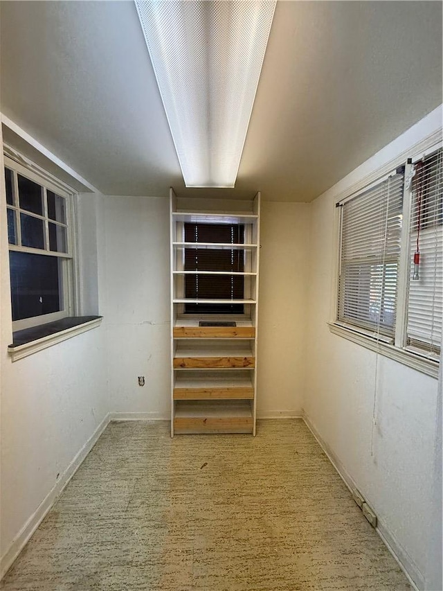 spare room featuring baseboards