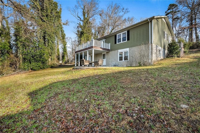 view of front of house featuring a front lawn and a patio