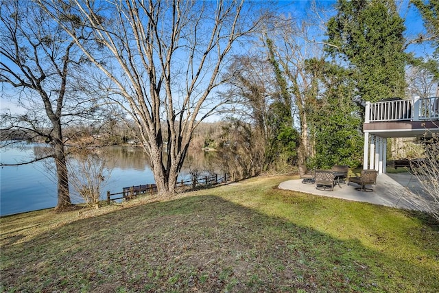 view of yard with a patio and a water view