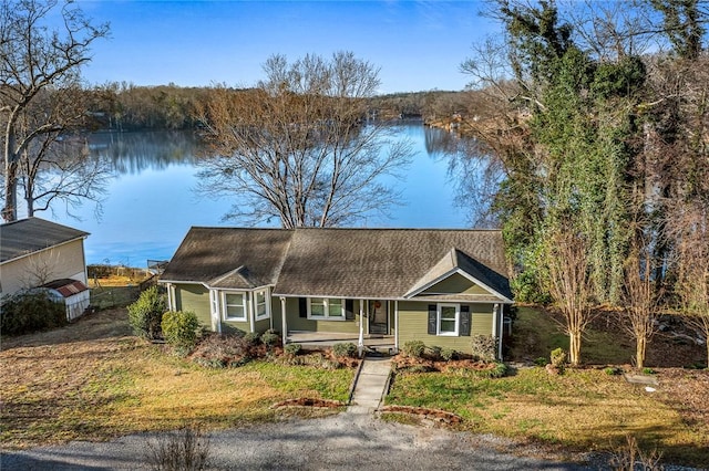 view of front of house featuring a water view, a porch, and a shingled roof