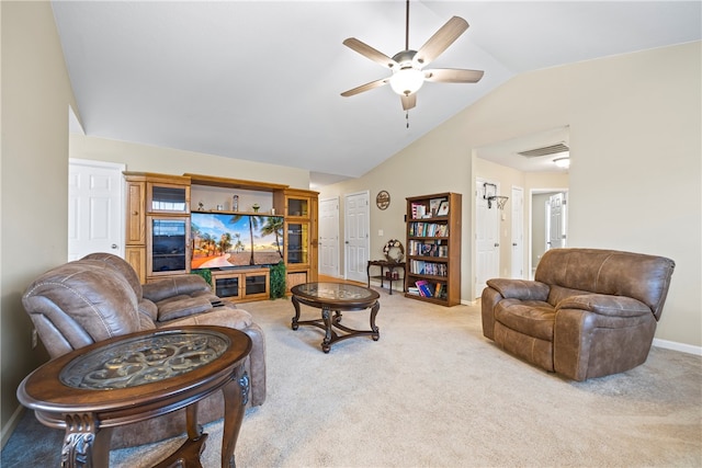 living area with a ceiling fan, visible vents, carpet floors, baseboards, and vaulted ceiling