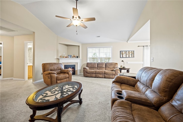 living room with lofted ceiling, visible vents, a tile fireplace, and light carpet