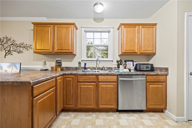 kitchen with dark countertops, dishwasher, a peninsula, and a sink