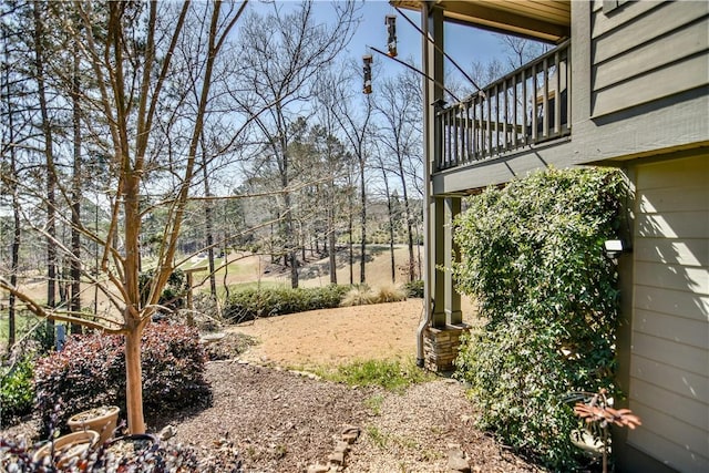 view of yard with a balcony