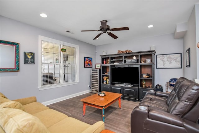 living room featuring a ceiling fan, wood finished floors, visible vents, baseboards, and recessed lighting