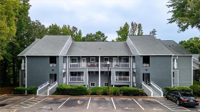 view of property featuring uncovered parking