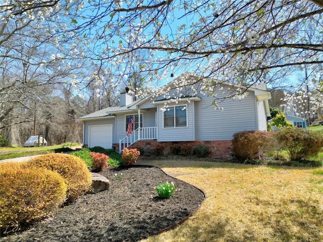 view of front of home with crawl space, a garage, a front lawn, and a chimney