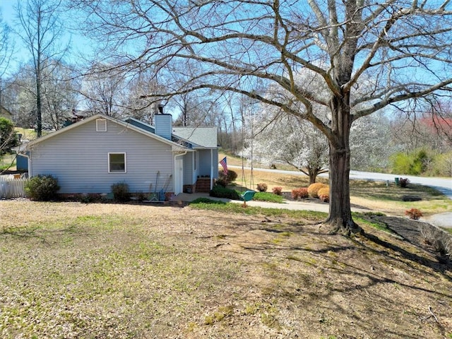 view of home's exterior with a chimney