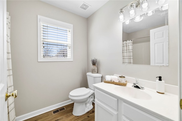 full bath with wood finished floors, toilet, baseboards, and visible vents