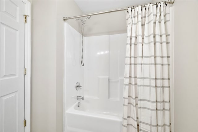 full bathroom with shower / tub combo