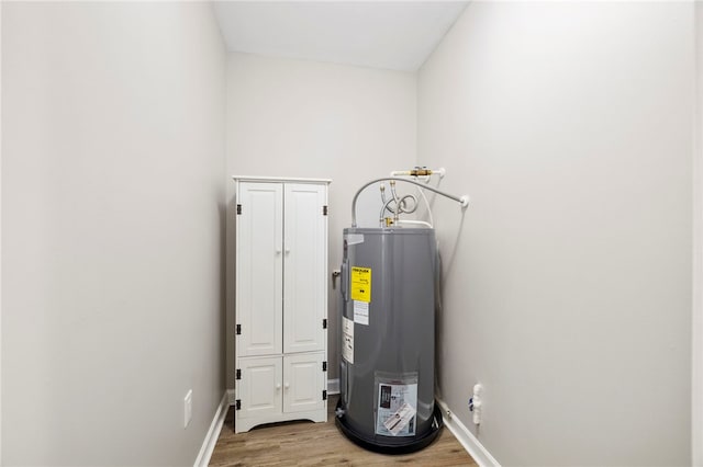 utility room featuring water heater