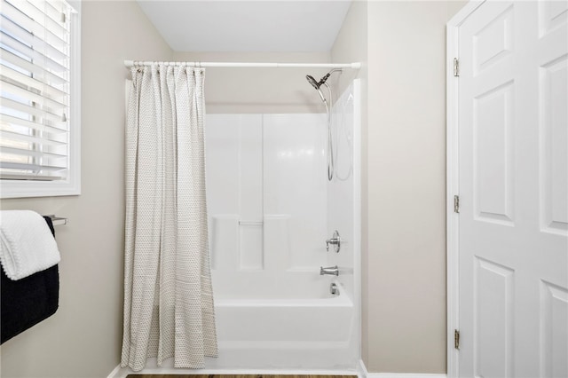 full bathroom with shower / bath combo with shower curtain