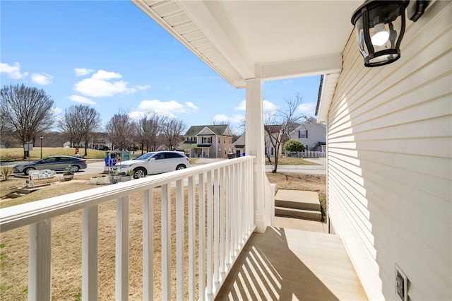 balcony with a residential view and covered porch