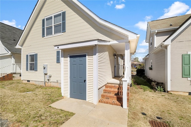 exterior space with a lawn and crawl space