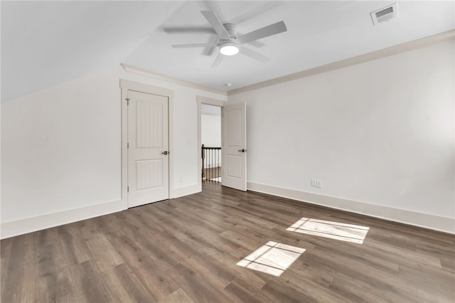 spare room with visible vents, ceiling fan, baseboards, and wood finished floors