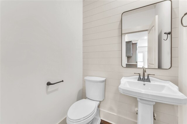 bathroom with toilet and a sink