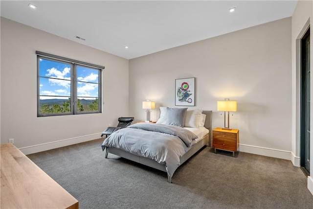 carpeted bedroom featuring recessed lighting, visible vents, and baseboards