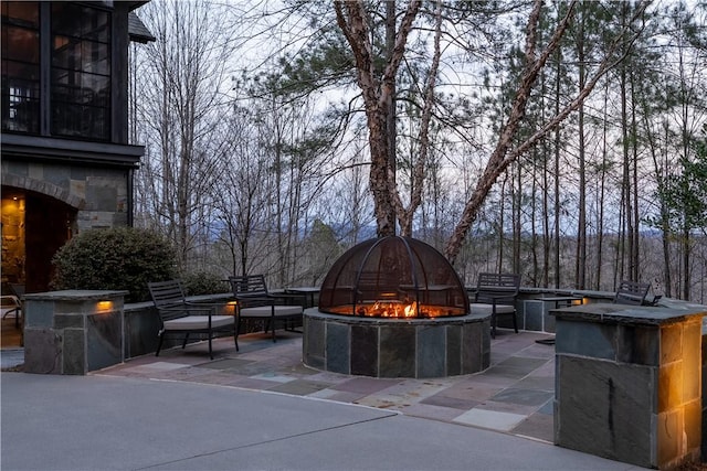 view of patio featuring an outdoor fire pit