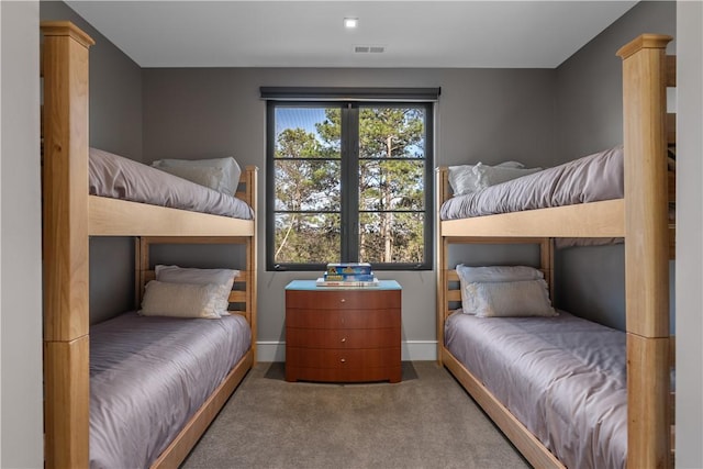 carpeted bedroom with baseboards