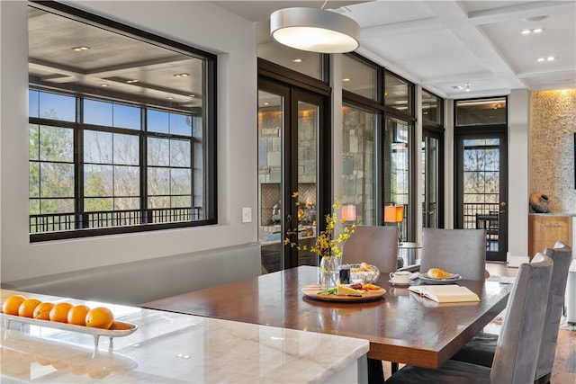 dining space with beamed ceiling, recessed lighting, and coffered ceiling