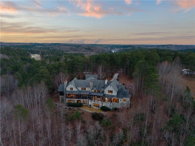 birds eye view of property with a wooded view