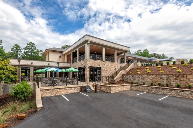 uncovered parking lot featuring stairway