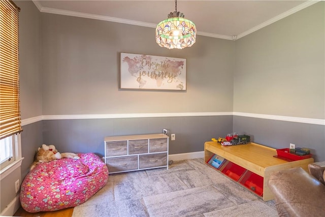 game room featuring baseboards, ornamental molding, and carpet flooring